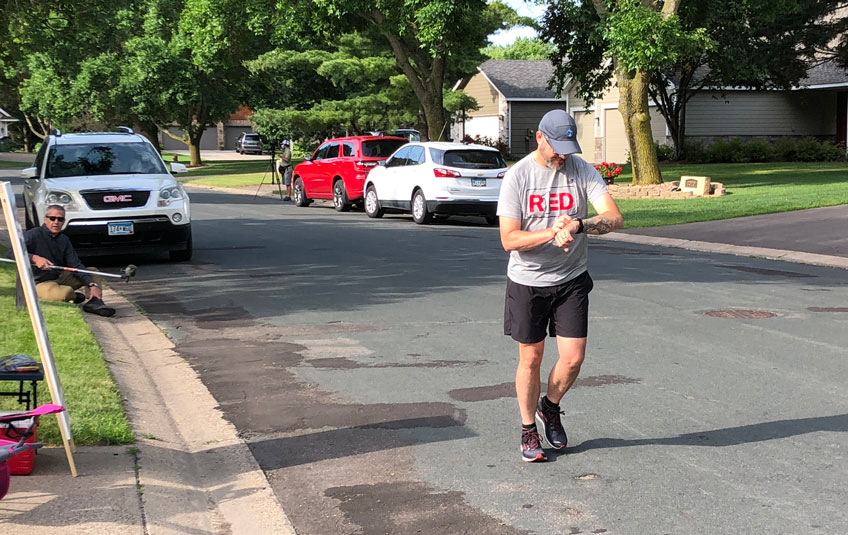 A man running on a suburban street