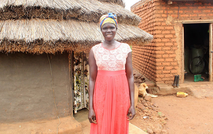 photo of Beatrice standing in front of a house