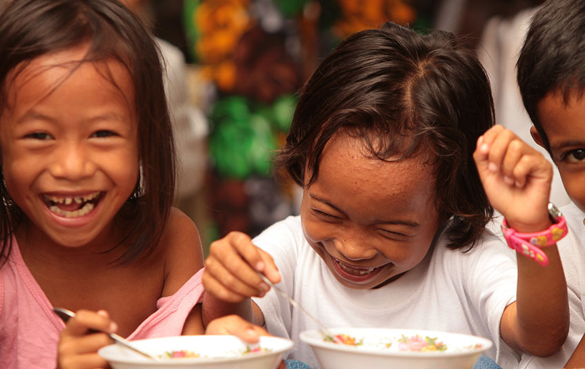 two girls eating FMSC food