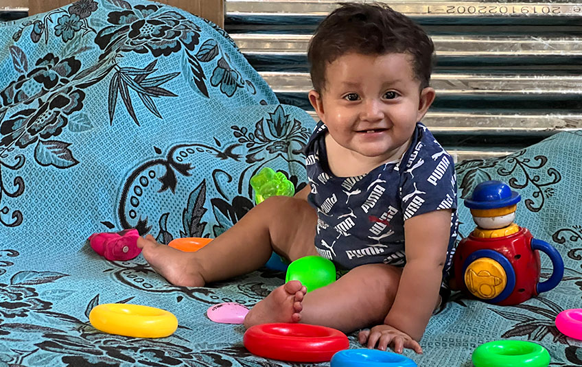 Jefferson as a baby playing with toys