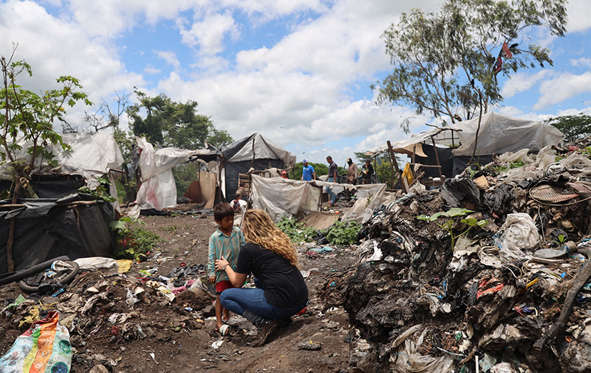 a child in a garbage dump