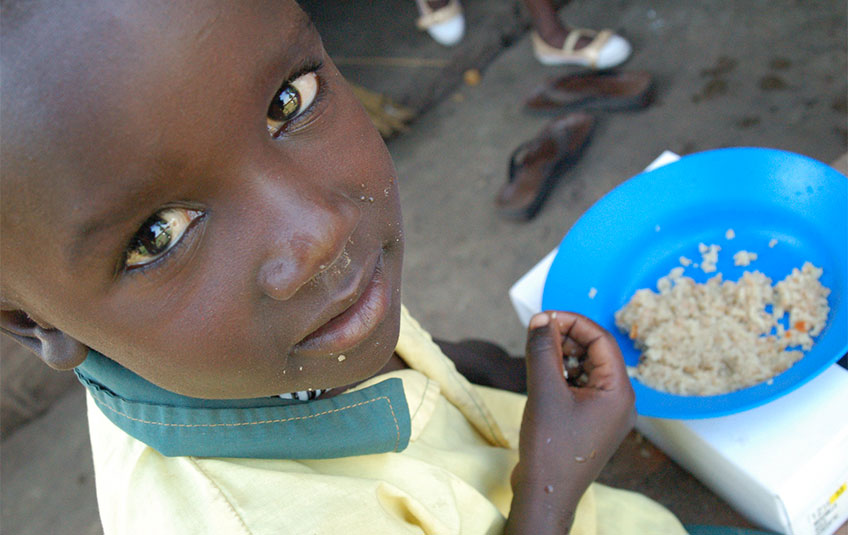 Sudanese child eating FMSC food