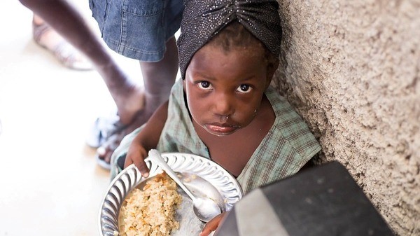 Girl eating MannaPack Rice in Caribbean