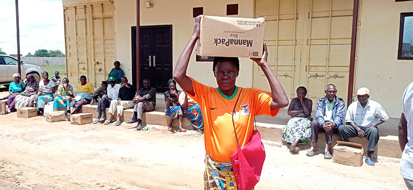 Woman carrying MannaPack box