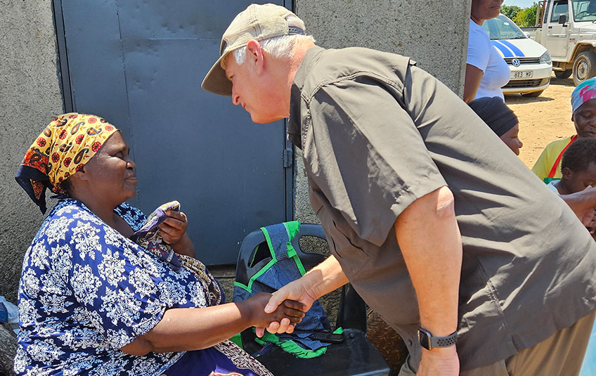 FMSC CEO Mark Crea shaking hands with a woman