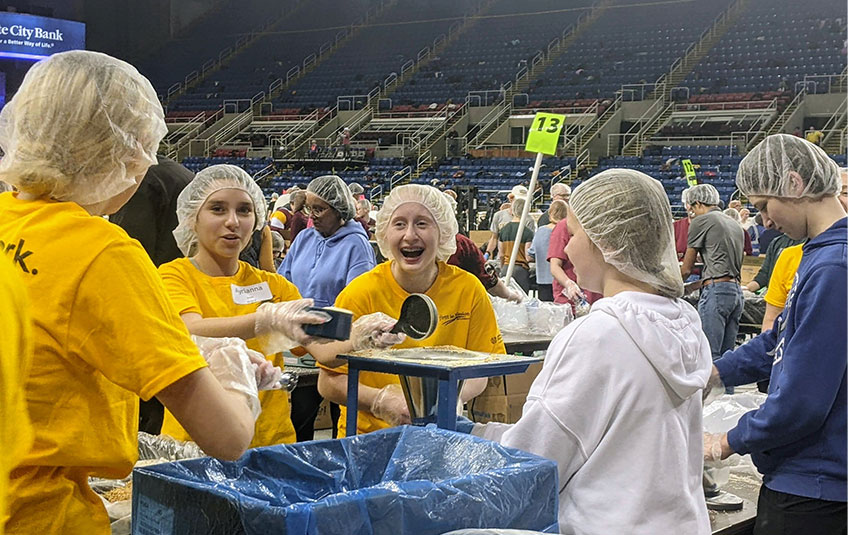 Volunteers packing FMSC meals at the FargoDome in Fargo ND