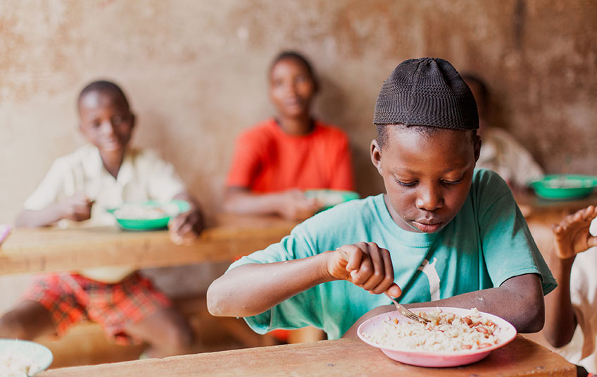 a child eating FMSC food in school