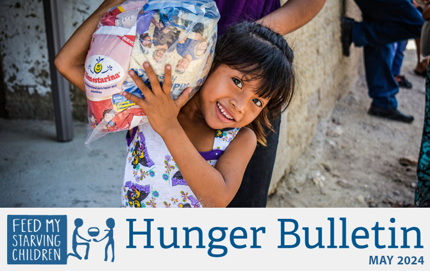 Girl in Guatemala holding FMSC food