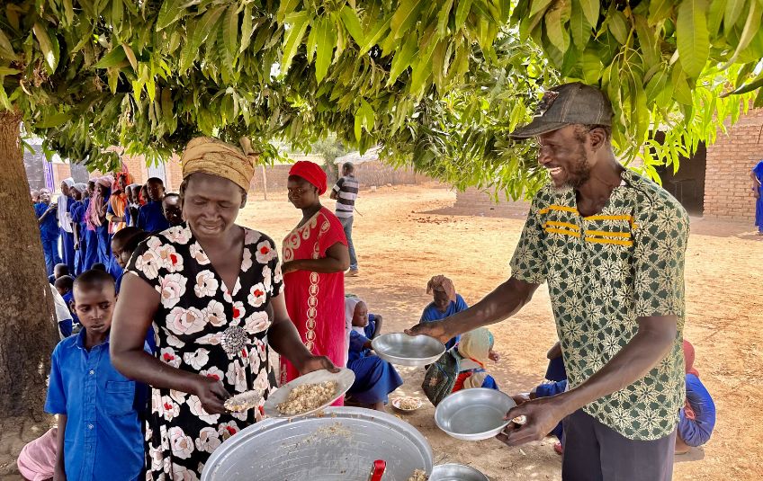 Adults serving MannaPack Mix in Chad. 