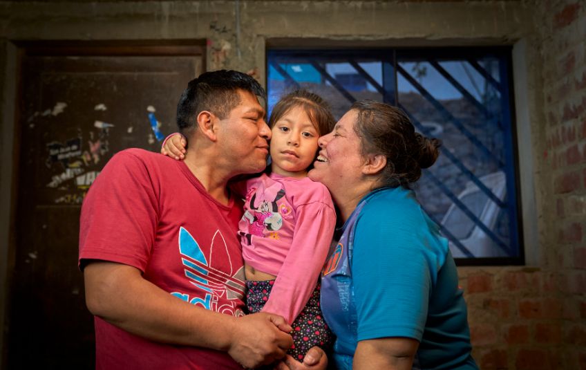 Yaritza with her husband and daughter