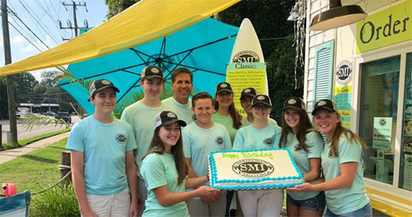 snowmania staff with cake