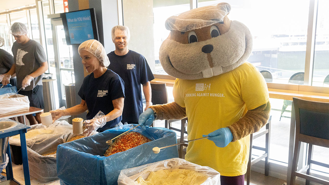 Goldy Gopher packs FMSC meals at Target Field in Minneapolis