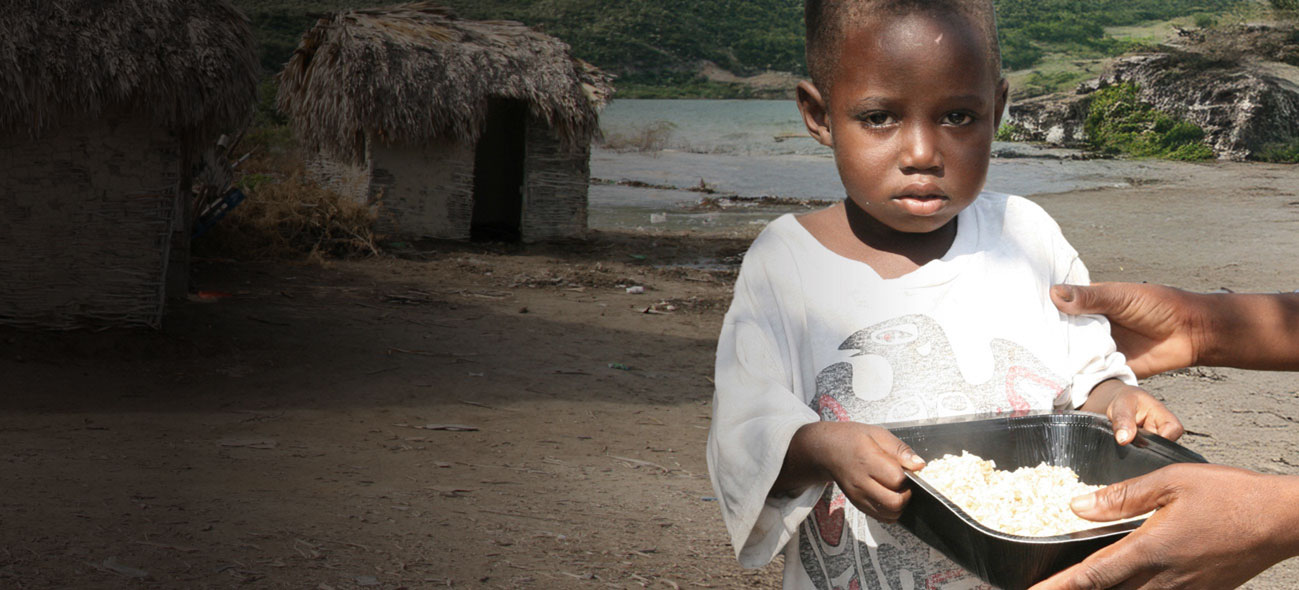 A child holding a bowl of FMSC food