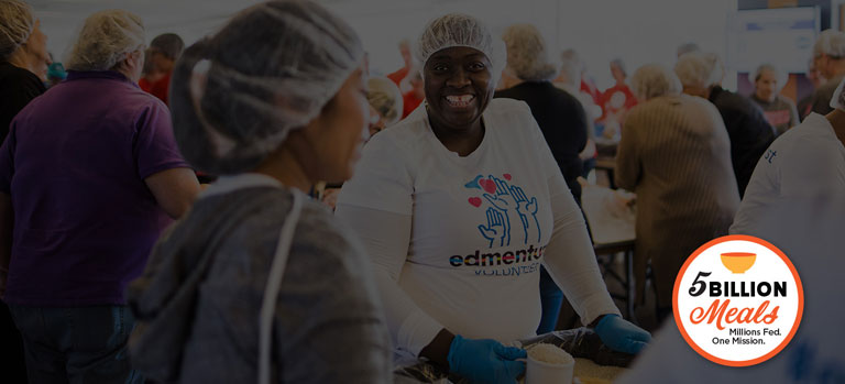 Volunteers packing FMSC food at a MobilePack event