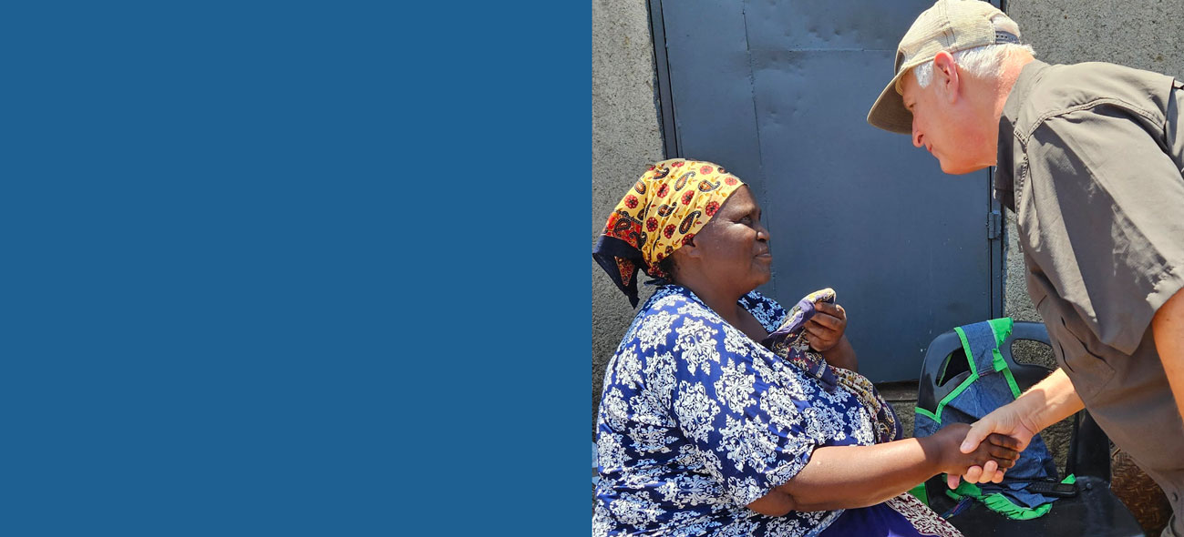 FMSC CEO Mark Crea shakes hands with a woman