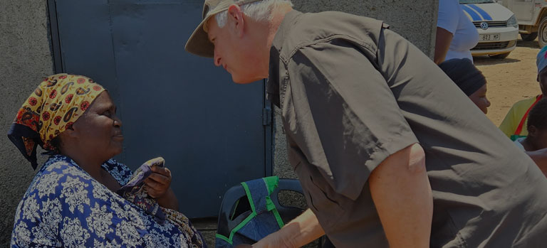 FMSC CEO Mark Crea shakes hands with a woman