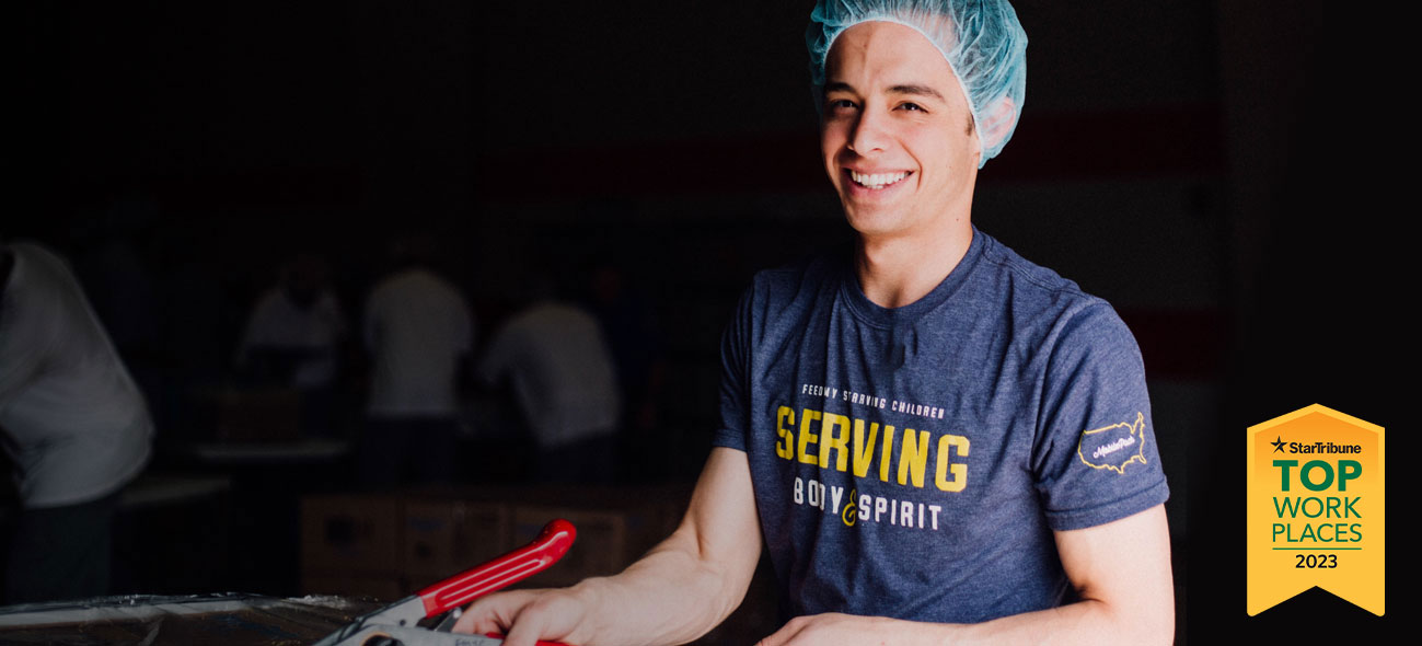 FMSC employee wrapping a pallet of food