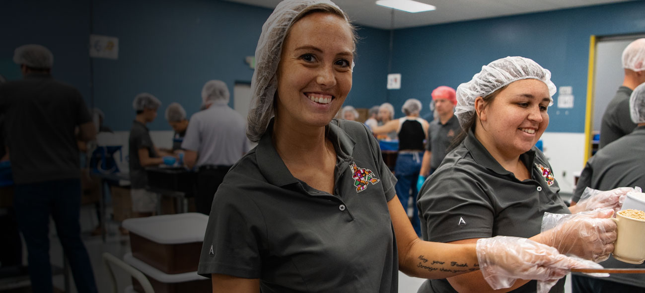 Volunteers packing FMSC meals