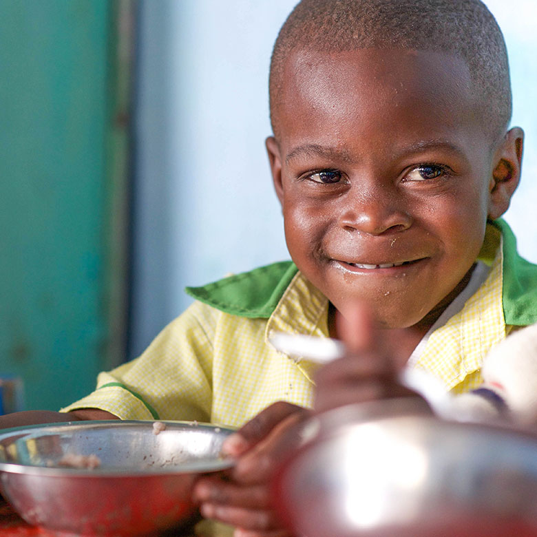 Child eating MannaPack Rice