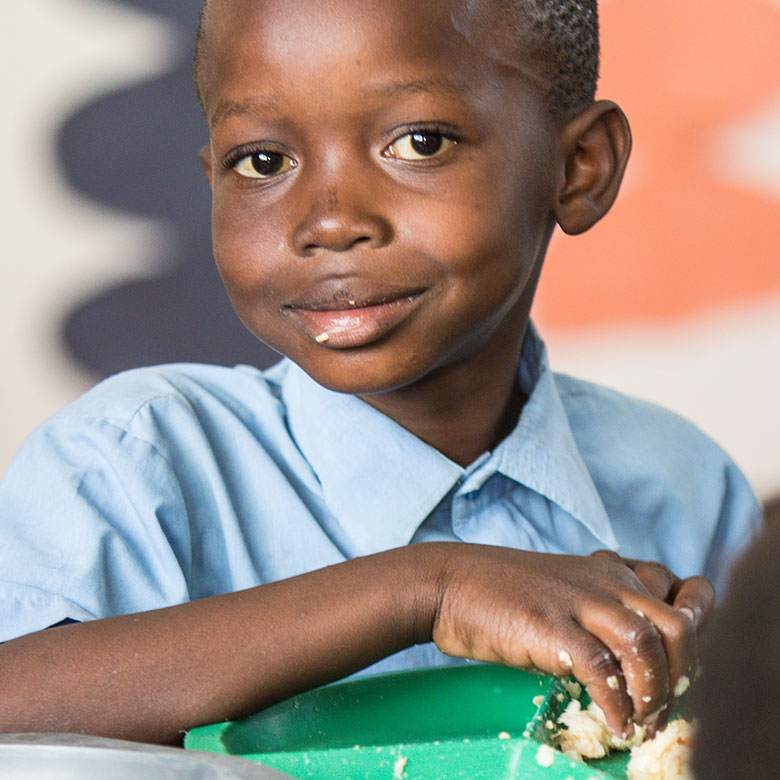 Child eating MannaPack Rice