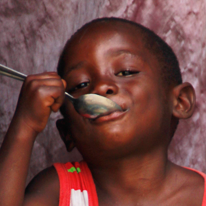 Child eating MannaPack Rice