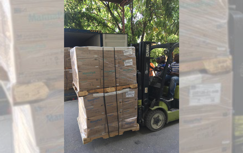 A container of FMSC meals being unloaded